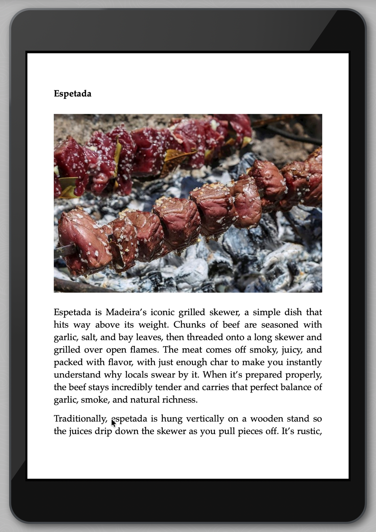 iPad displaying an article about Espetada, a traditional Madeira dish.