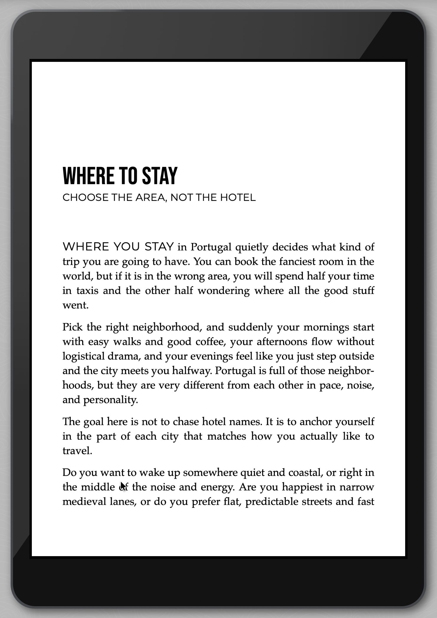 E-reader displaying text about choosing a neighborhood to stay in Portugal, not just a hotel.
